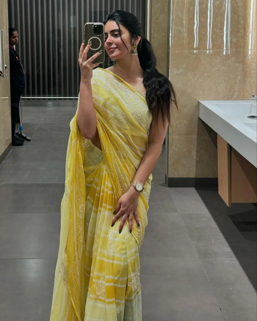 Kushita Kallapu In Traditional Yellow Saree White Blouse